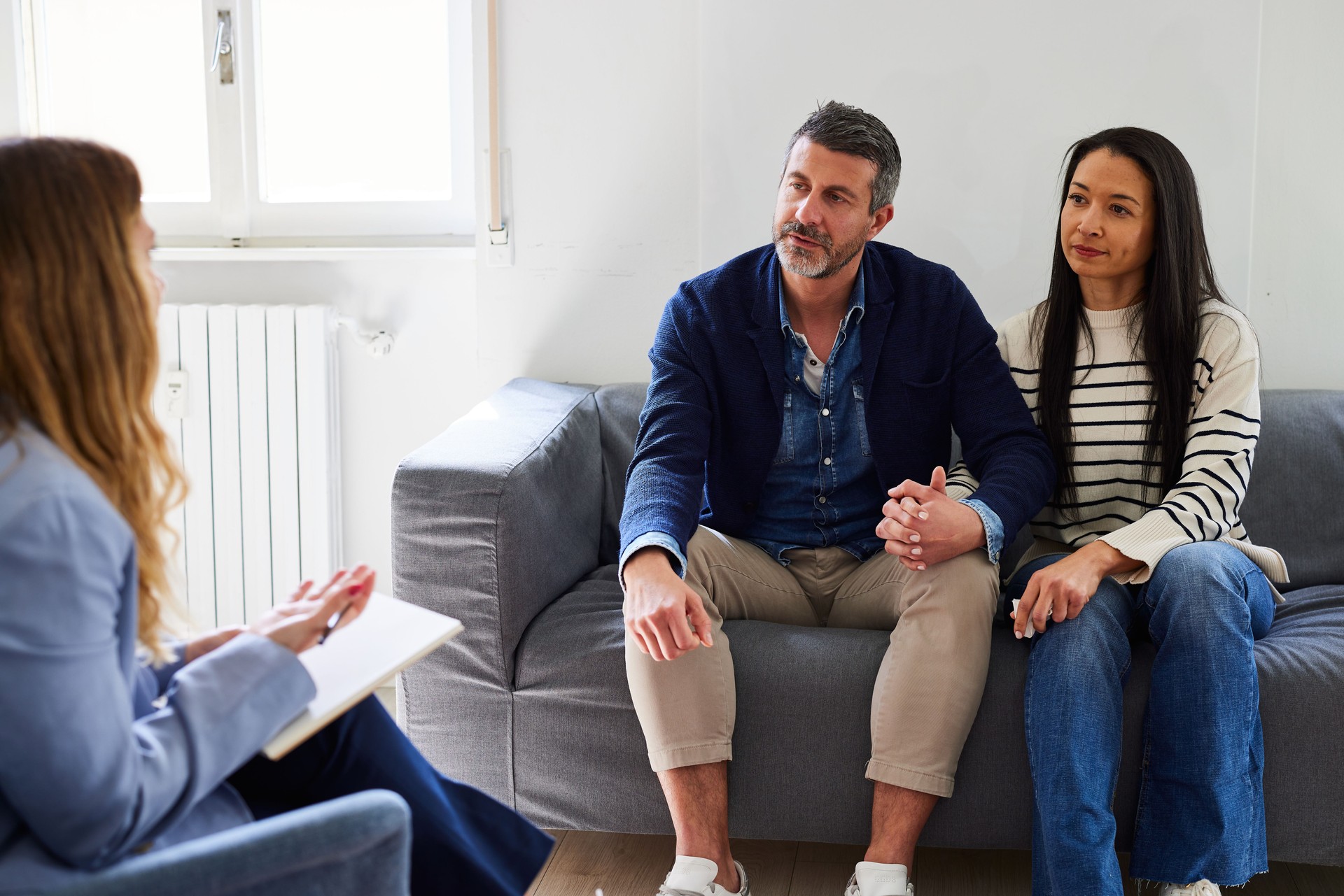 Psychologist guiding couple in resolving marriage issues